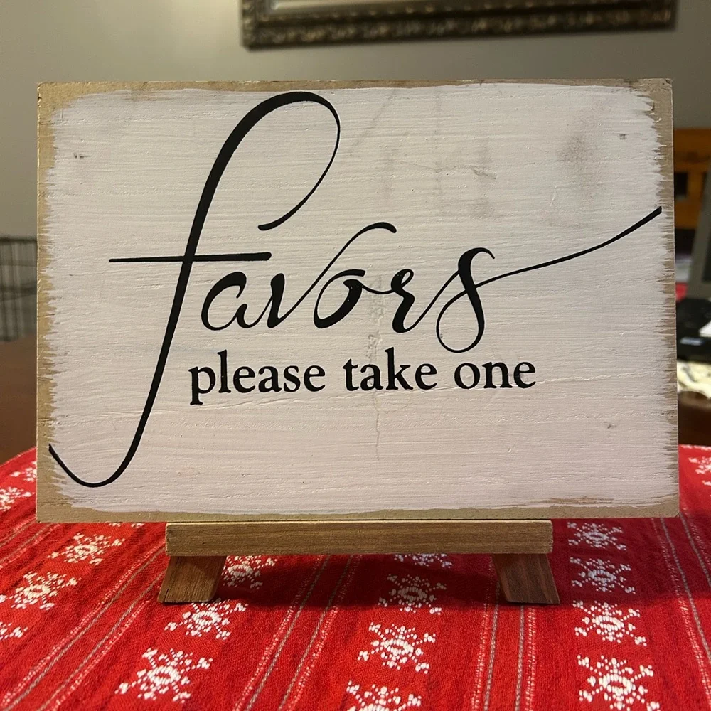 White and Black Favor Sign on Easel